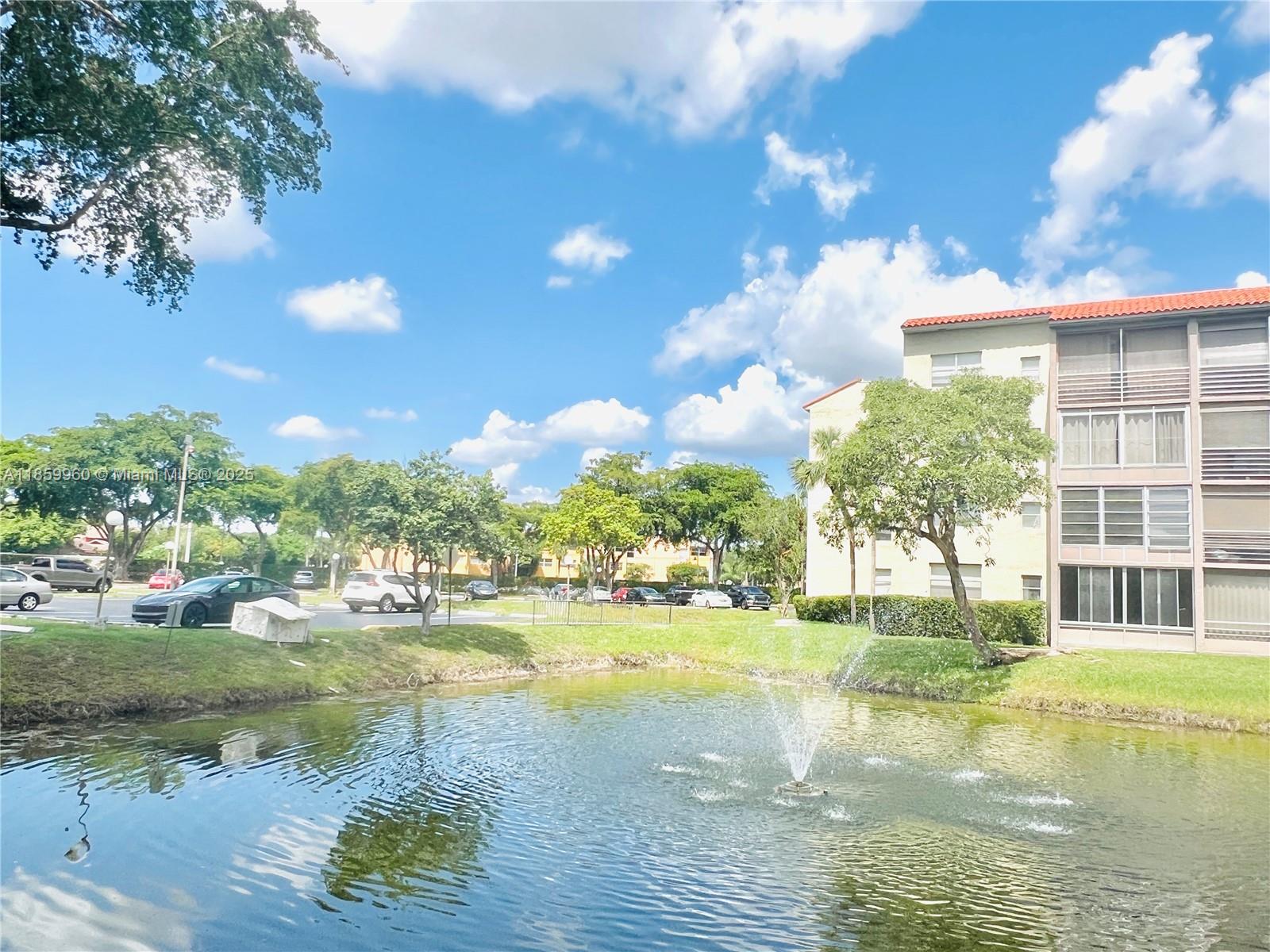 1810 Southwest 81st Avenue, Unit 2201 North Lauderdale, FL 33068 - Photo 16 of 32 a view of a lake with a big yard