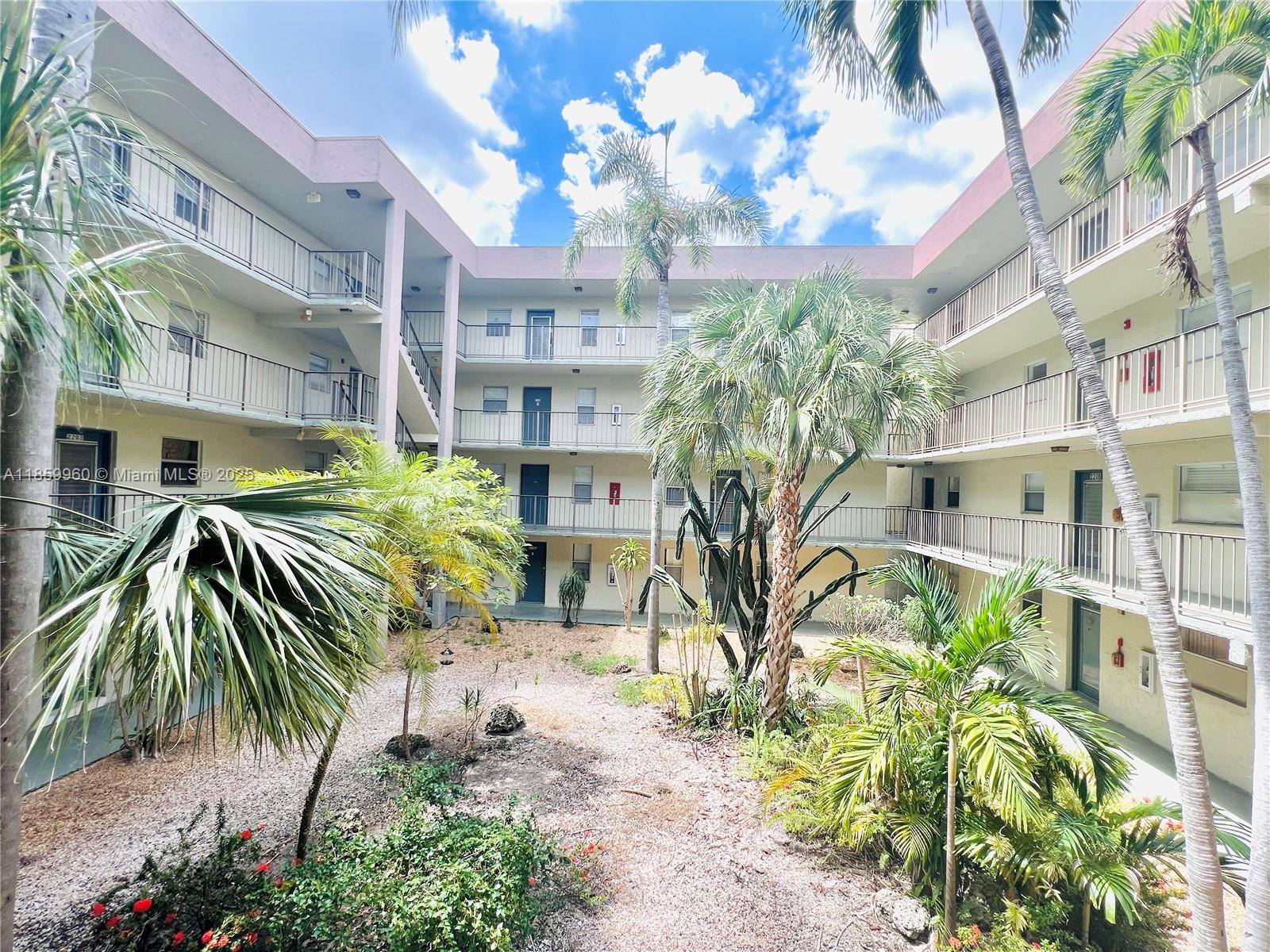 1810 Southwest 81st Avenue, Unit 2201 North Lauderdale, FL 33068 - Photo 18 of 32 a view of path and chair