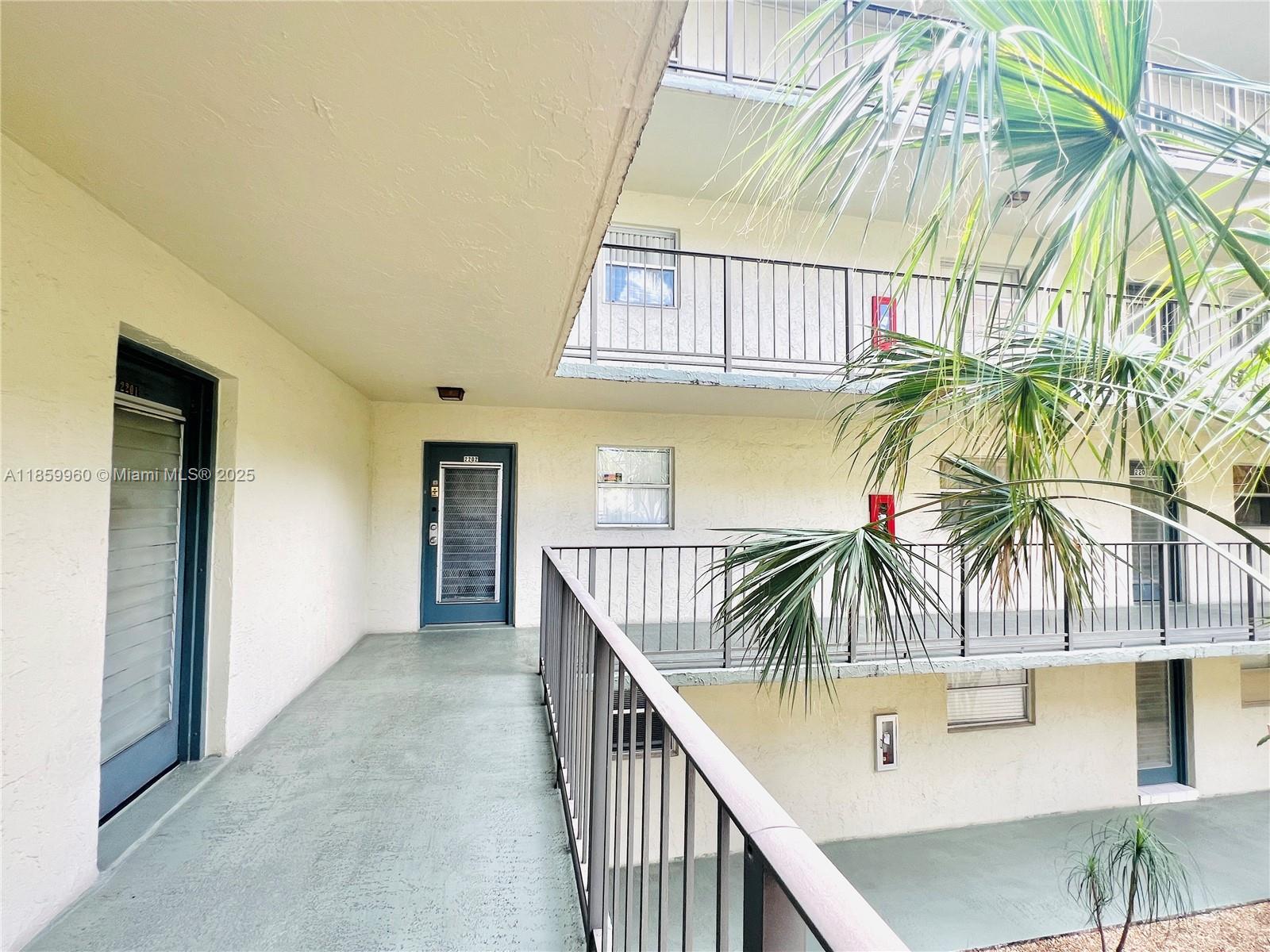 1810 Southwest 81st Avenue, Unit 2201 North Lauderdale, FL 33068 - Photo 19 of 32 a view of entryway and hall with wooden floor