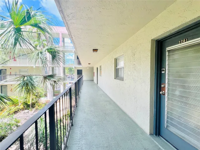 a view of balcony with wooden floor and stairs