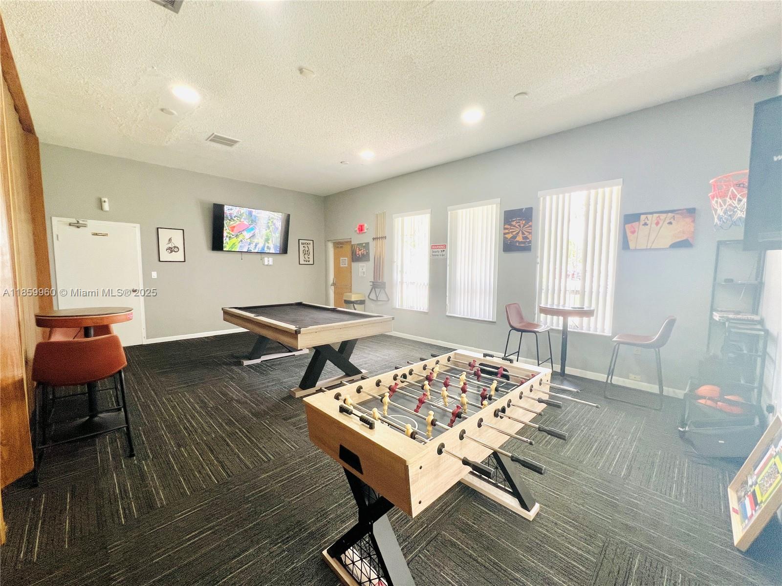 1810 Southwest 81st Avenue, Unit 2201 North Lauderdale, FL 33068 - Photo 27 of 32 a living room with furniture and a wooden floor