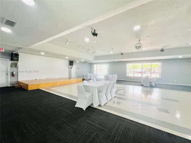 a view of a living room and kitchen floor