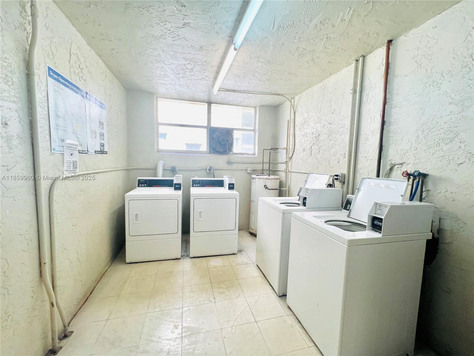 1810 Southwest 81st Avenue, Unit 2201 North Lauderdale, FL 33068 - Photo 30 of 32 a utility room with dryer and washer