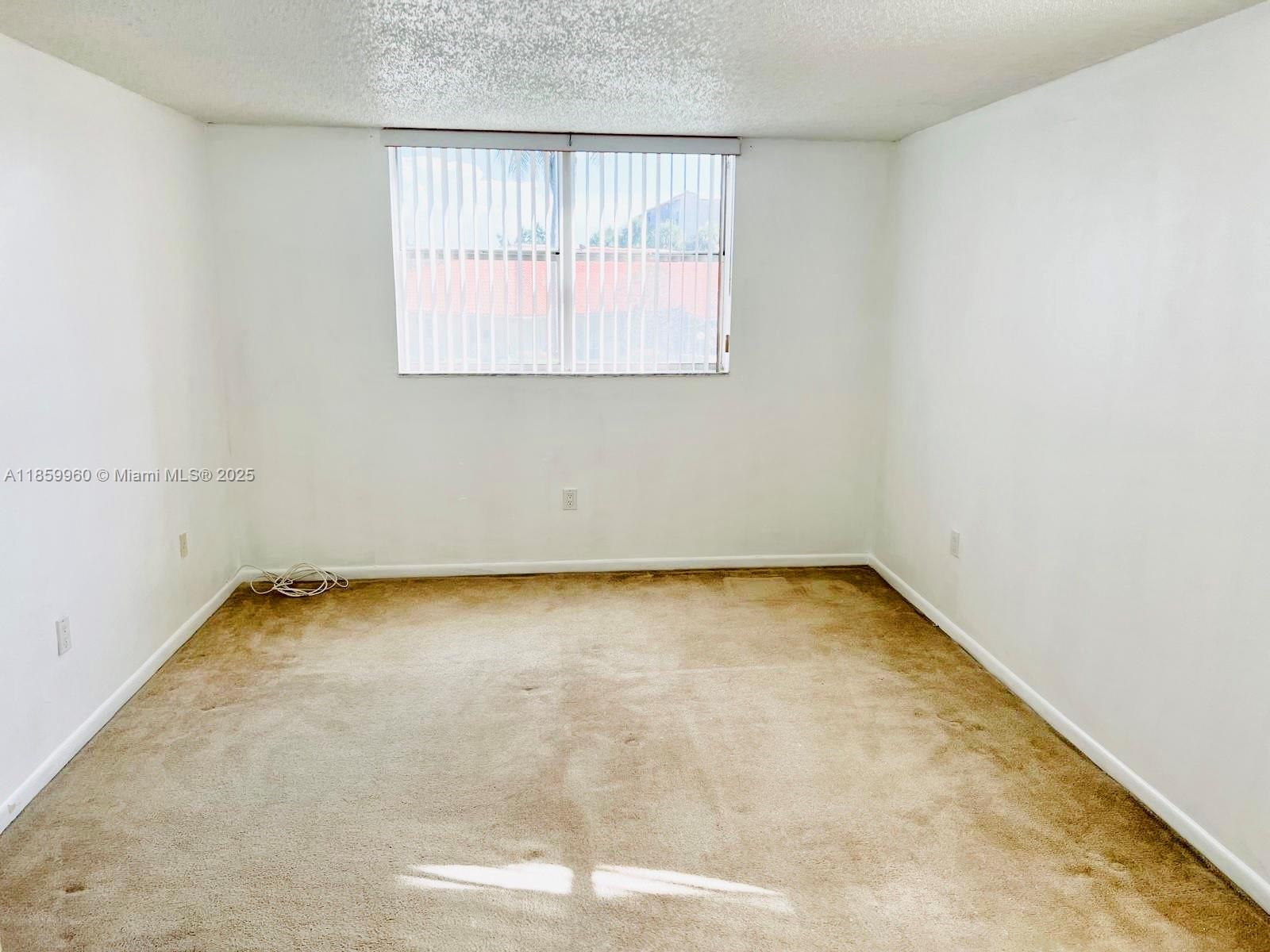 1810 Southwest 81st Avenue, Unit 2201 North Lauderdale, FL 33068 - Photo 9 of 32 an empty room with a window