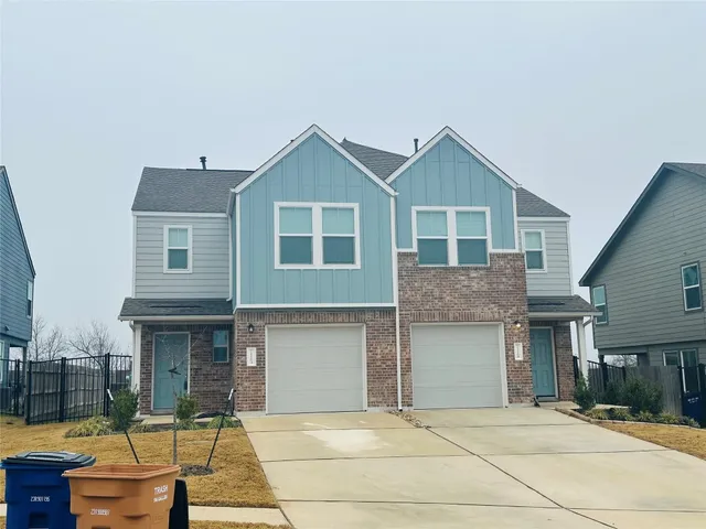 a front view of a house with garage