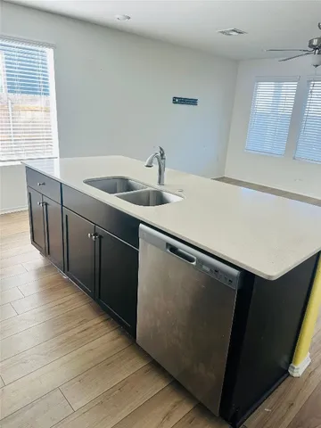 a utility room with sink dryer and washer