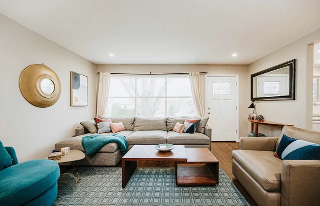 a living room with furniture and a window