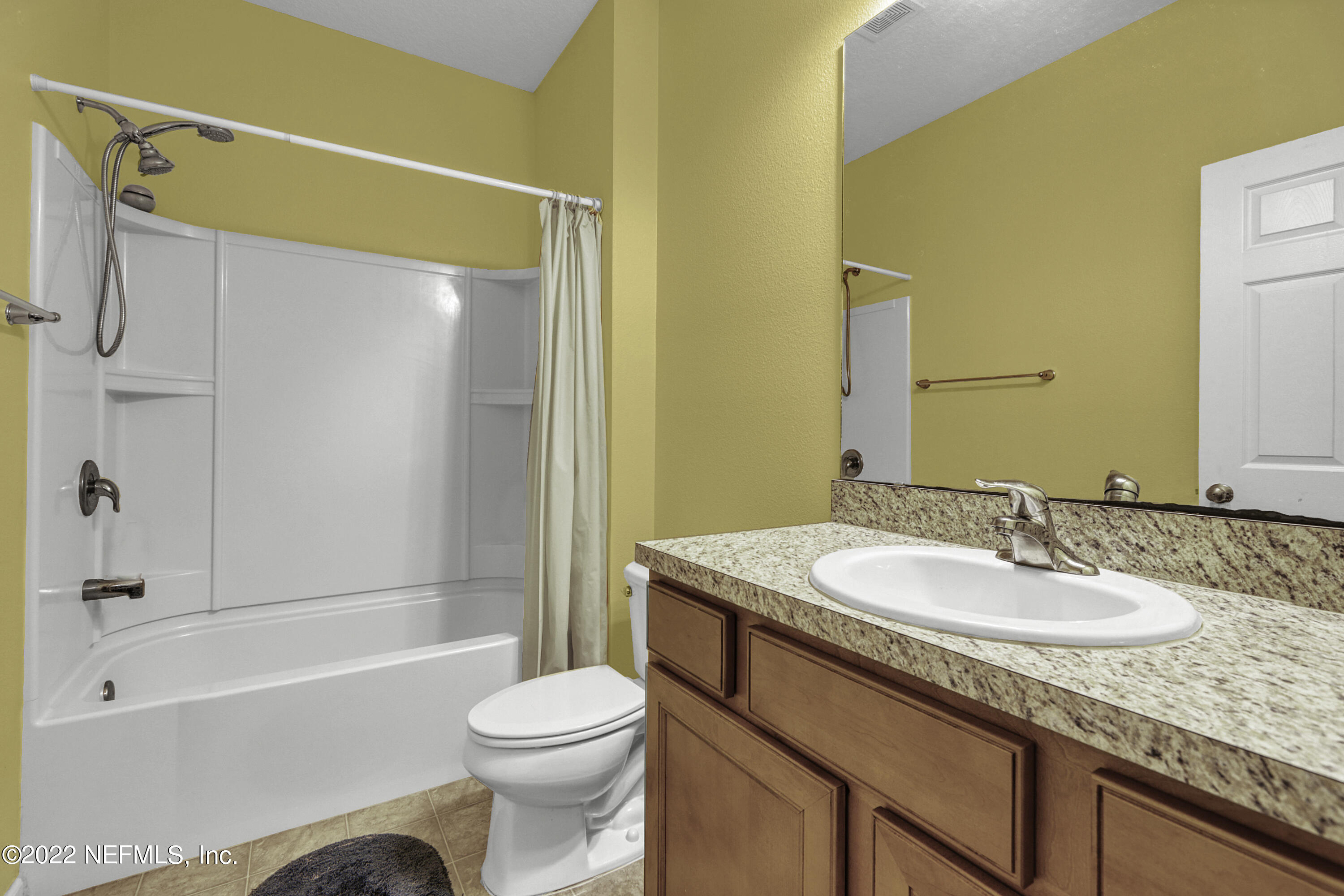 300 Auburn Oaks Road East Jacksonville, FL 32218 - Photo 3 of 15 a bathroom with a granite countertop sink toilet and shower