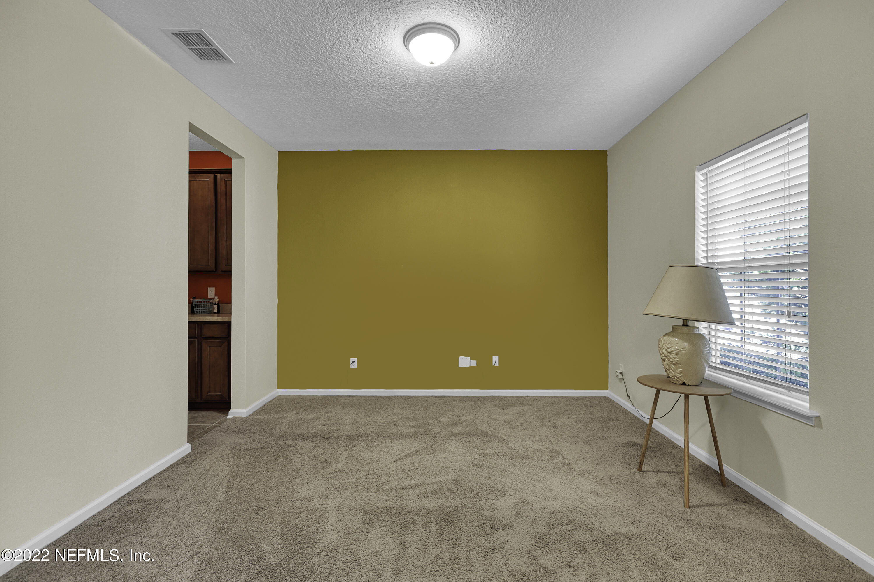 300 Auburn Oaks Road East Jacksonville, FL 32218 - Photo 4 of 15 a view of an empty room with a window