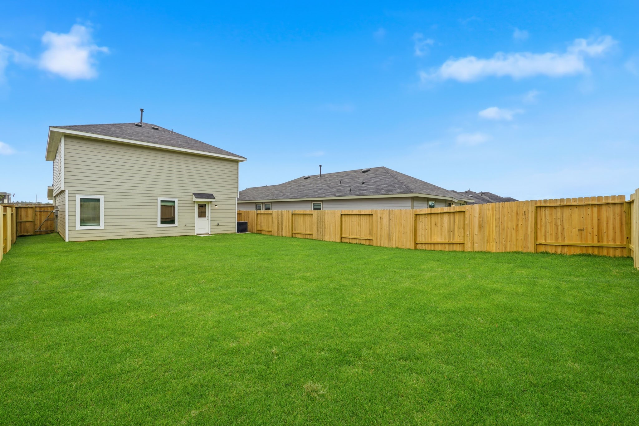 14357 Tawny Street Splendora, TX 77372 - Photo 21 of 28 a view of a backyard with table and chairs