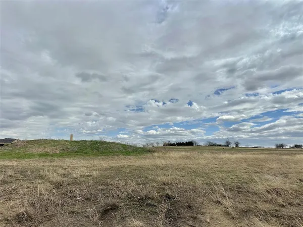 a view of a lake from a yard