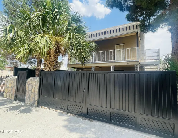 a front view of a house with a garage