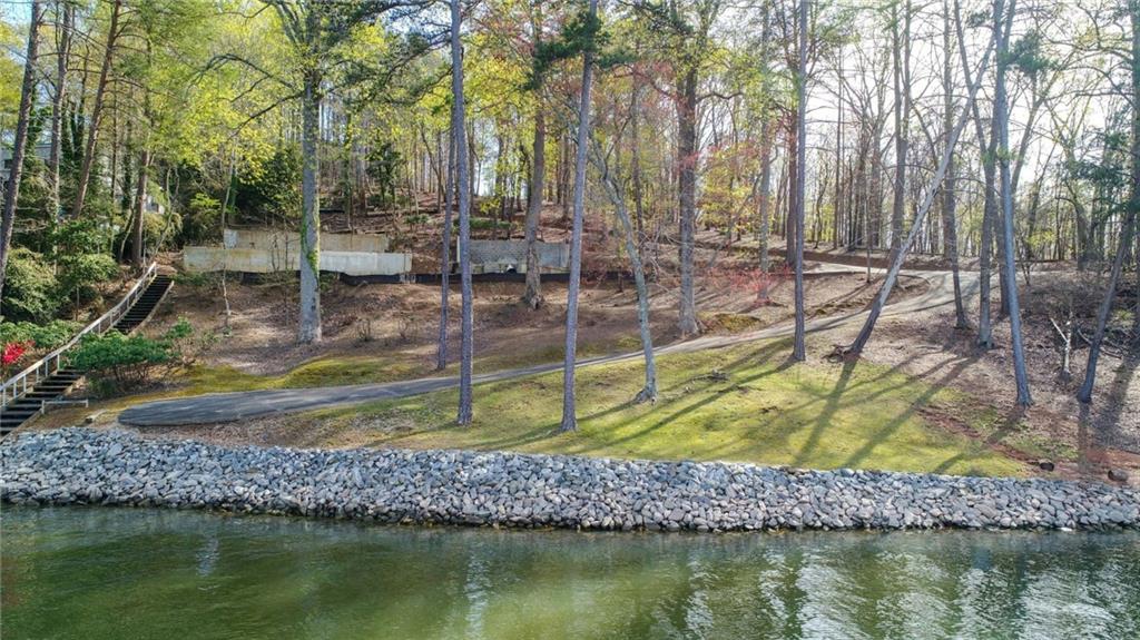 a view of swimming pool with a patio and a yard
