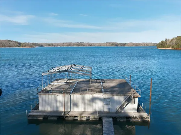 a view of a lake in between two chairs