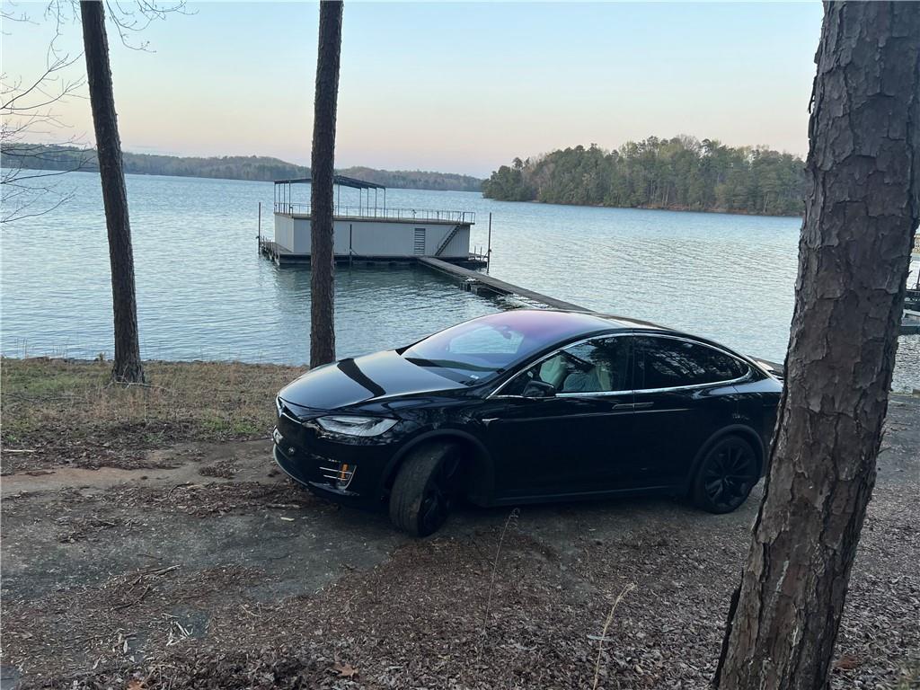 4368 Cherokee Trail Gainesville, GA 30504 - Photo 7 of 14 a car parked on the side of a lake