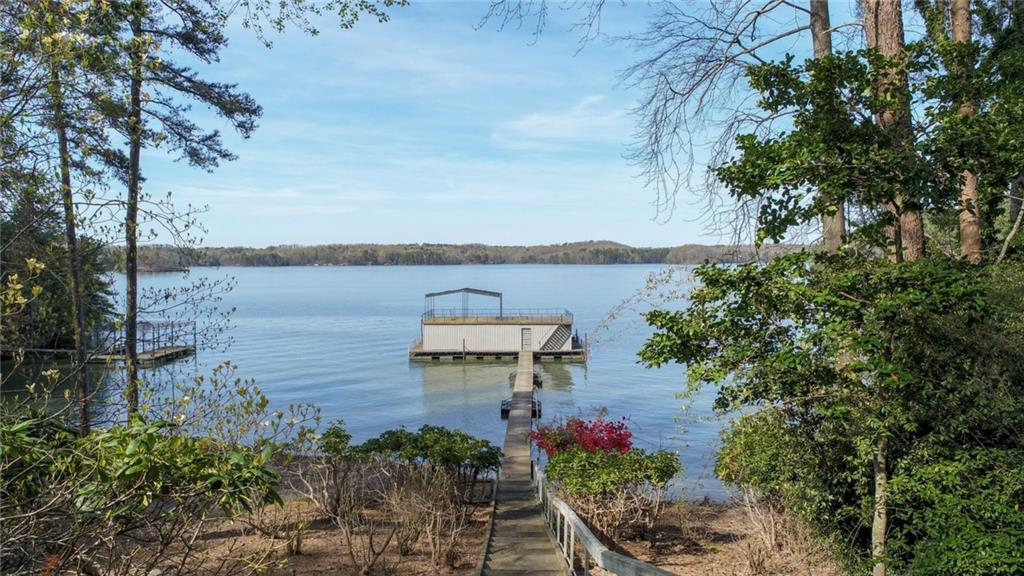 4368 Cherokee Trail Gainesville, GA 30504 - Photo 8 of 14 a view of a lake with a garden