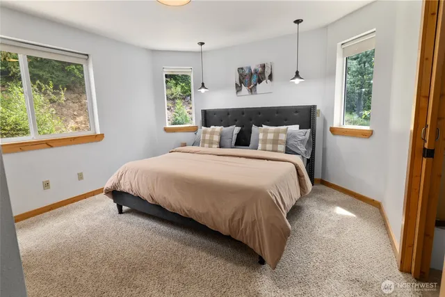 a bedroom with a bed and window