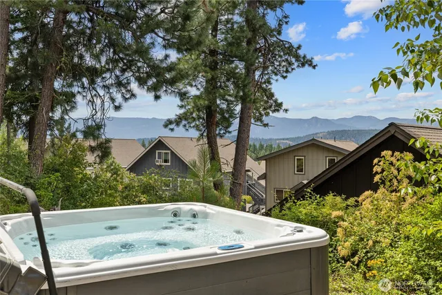 a view of house with a swimming pool