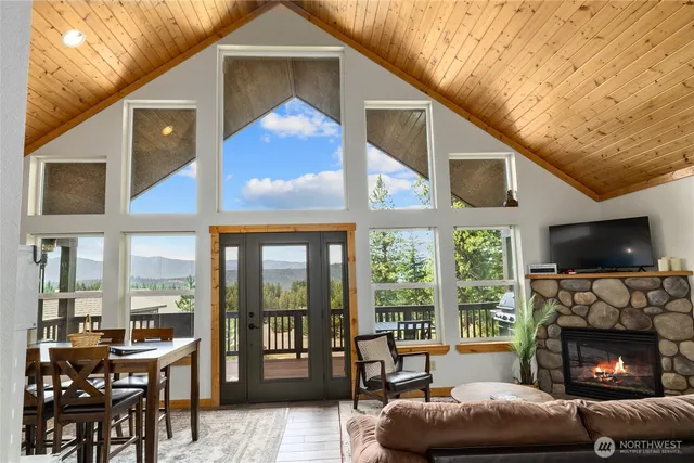 a living room with furniture fireplace and flat screen tv