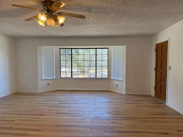 a view of room window and wooden floor