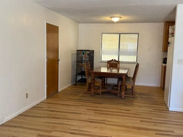 a view of a dining room with furniture and window