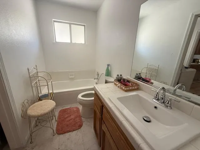 a bedroom with a bed and with windows