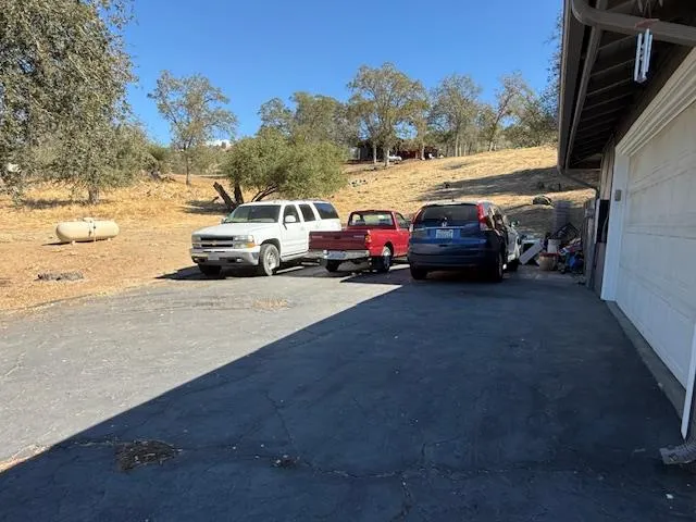 a view of street with parked cars