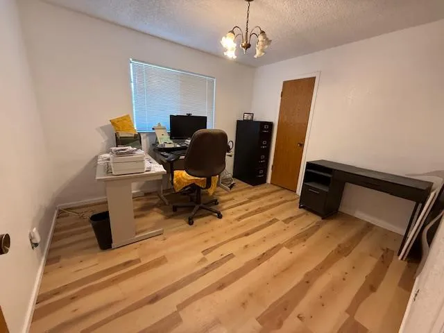 a living room with a table and chairs