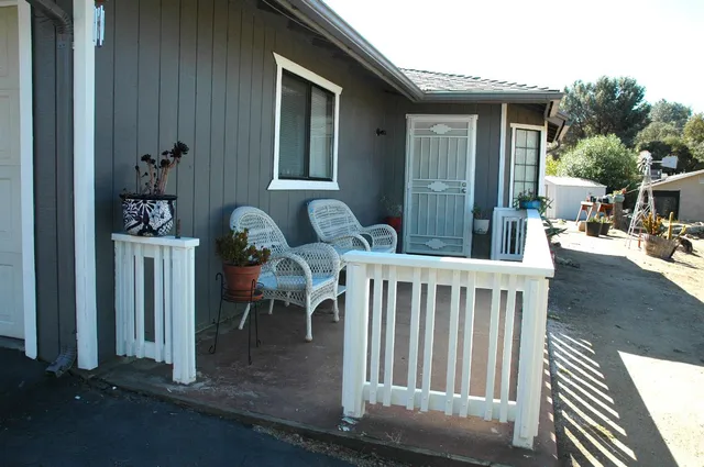 a view of balcony with furniture