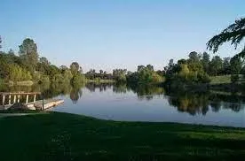 a childrens park with lots of swings and slides