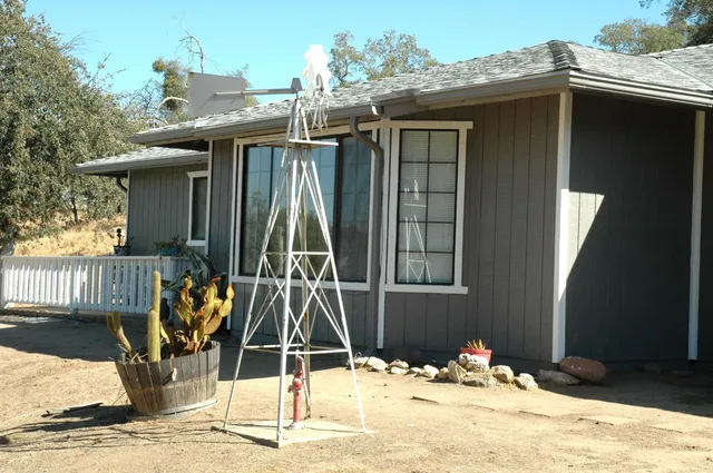 a house with swimming pool in front of it