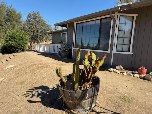 a view of a lake with a table and chairs