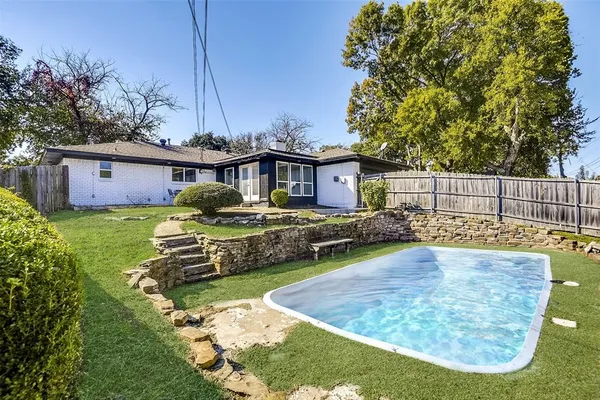 a view of a house with a big yard