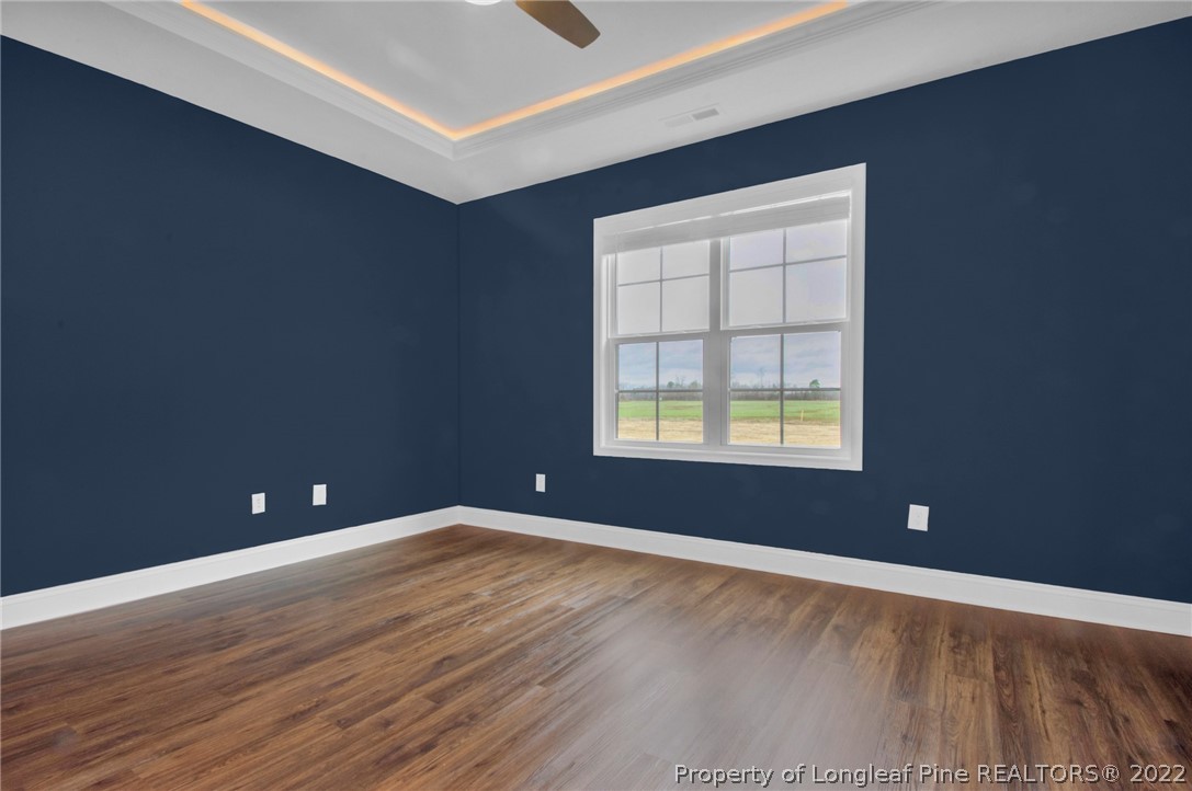 171 Mumford Road Raeford, NC 28376 - Photo 18 of 35 wooden floor and windows in an empty room