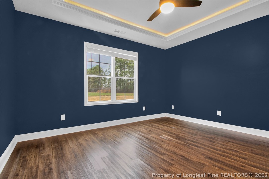 171 Mumford Road Raeford, NC 28376 - Photo 19 of 35 a view of an empty room with window and wooden floor