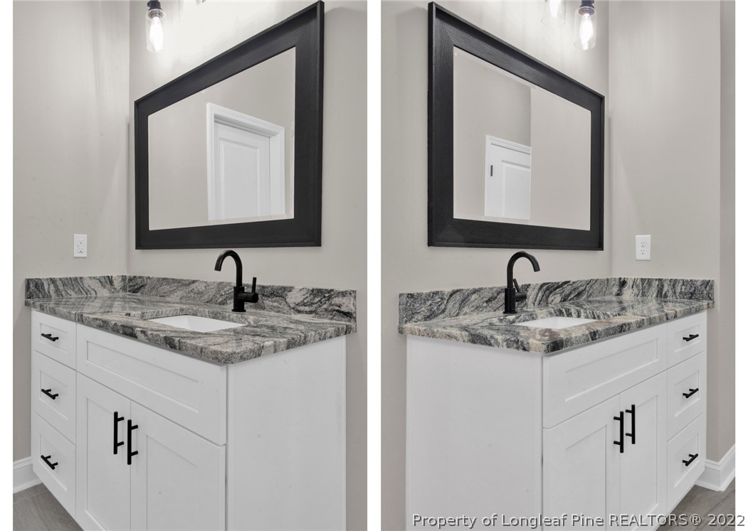 171 Mumford Road Raeford, NC 28376 - Photo 20 of 35 a bathroom with double sink and a mirror