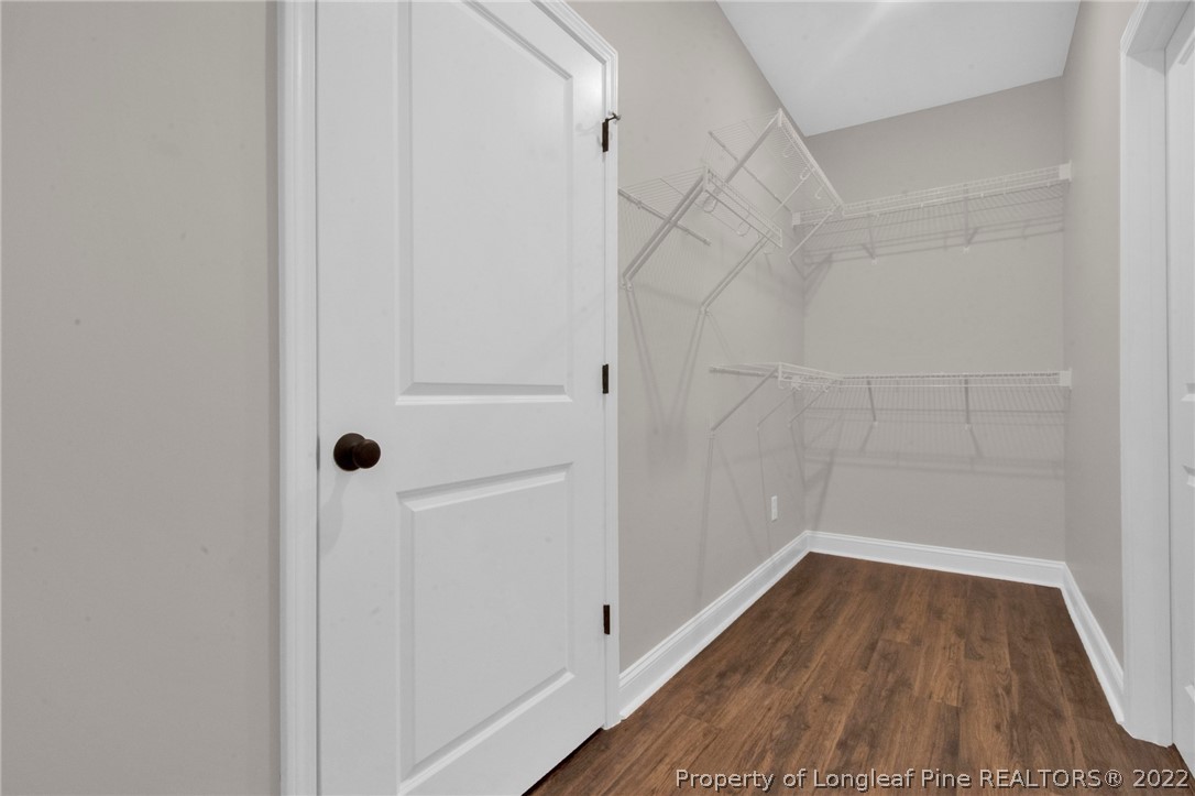171 Mumford Road Raeford, NC 28376 - Photo 30 of 35 a view of a room with wooden floor and white walls