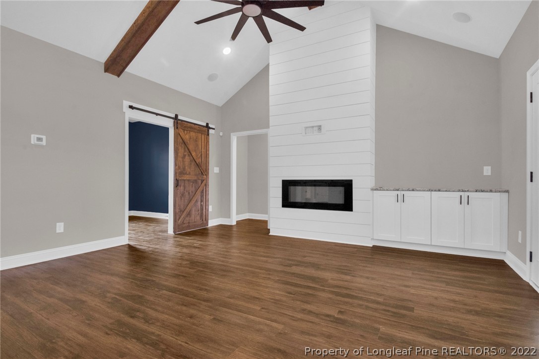 171 Mumford Road Raeford, NC 28376 - Photo 6 of 35 a view of an empty room with wooden floor