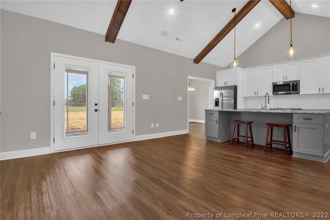 171 Mumford Road Raeford, NC 28376 - Photo 9 of 35 a view of kitchen with cabinets and wooden floor