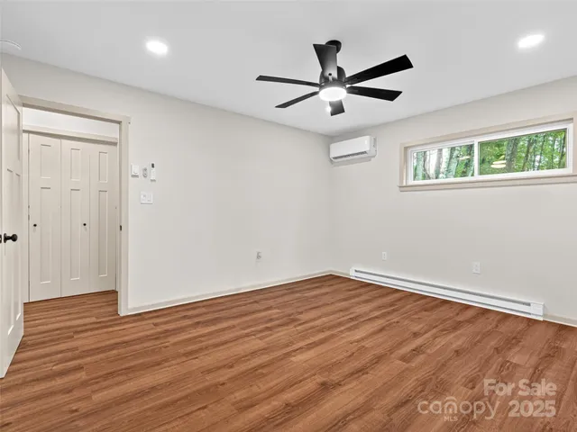 a bathroom with a toilet a sink and shower