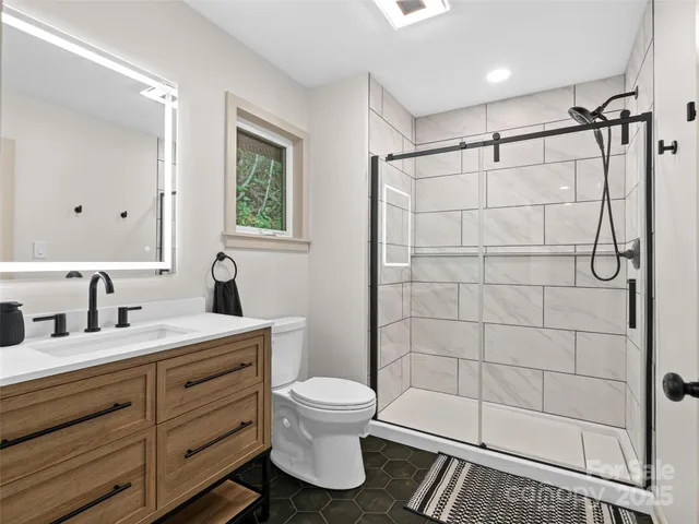a view of a storage and utility room with wooden floor