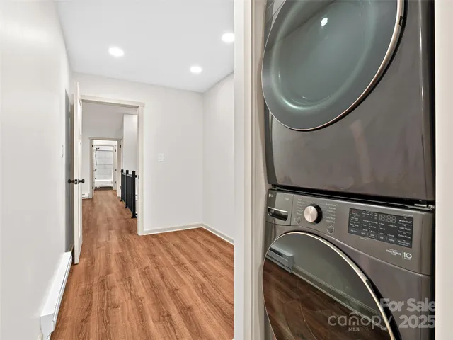 a view of a livingroom with a kitchen and a fireplace