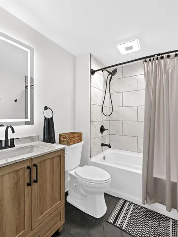 a view of a backyard with large trees