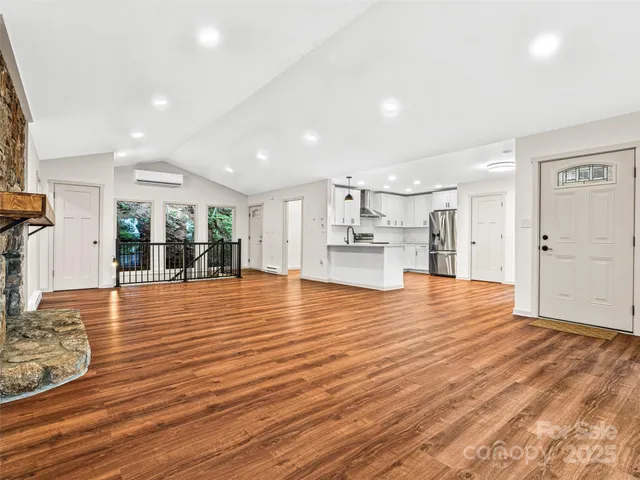 a view of kitchen with wooden floor and window