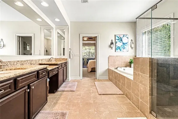 a large kitchen with granite countertop a stove and a sink