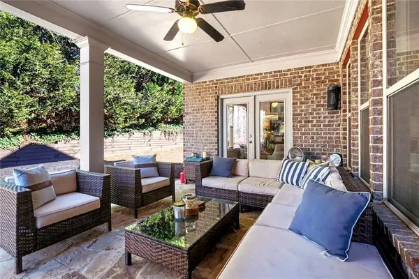 a view of a house with a yard and sitting area