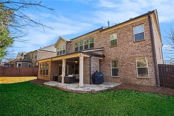 a view of a backyard with large trees