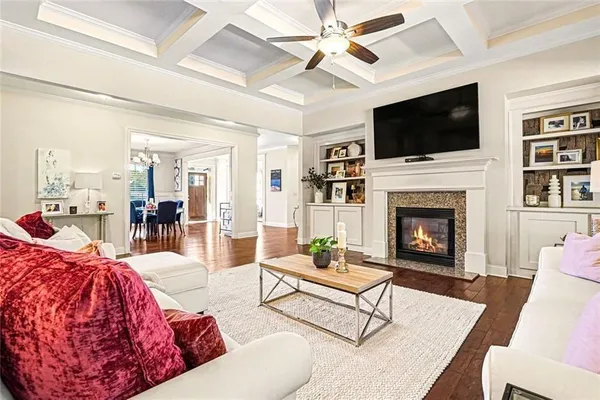 a living room with furniture fireplace and flat screen tv