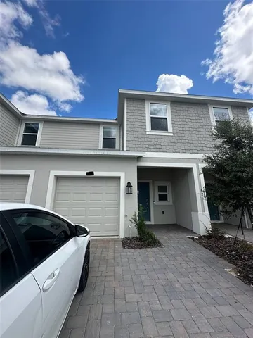 a front view of a house with garage