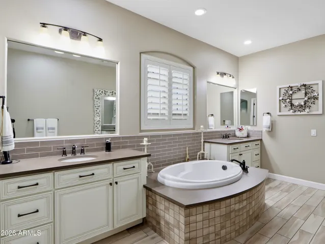 a bathroom with a shower curtain and a window
